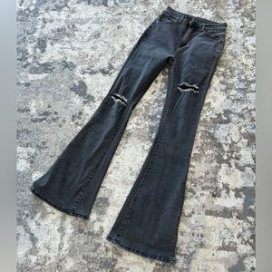 Black flare jeans with ankle slits